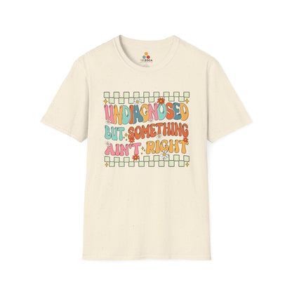 Beige t-shirt with colorful text design on a white background