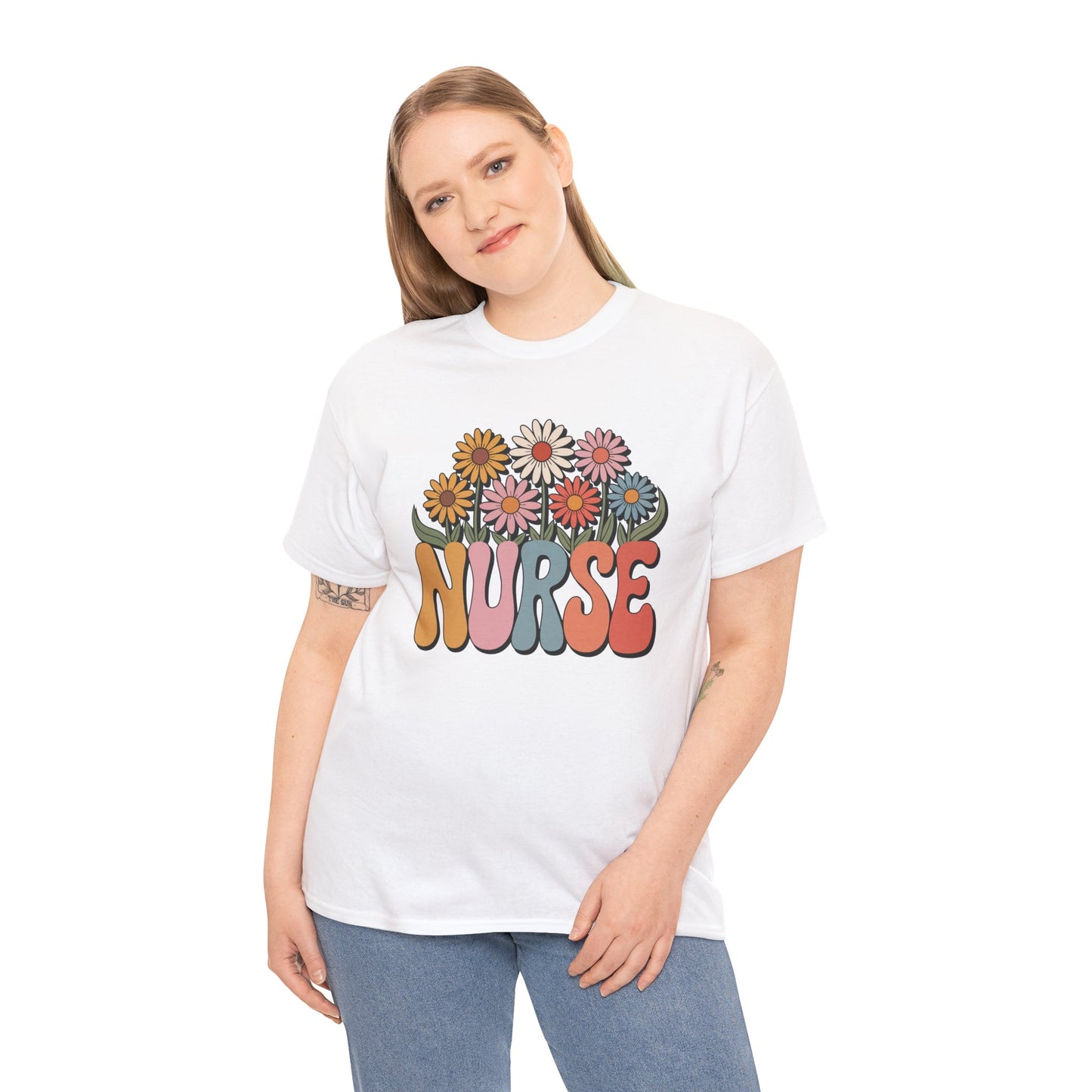“Female model wearing Teezoca groovy daisy Nurse t-shirt, retro flower NURSE graphic, white unisex tee, front.”

