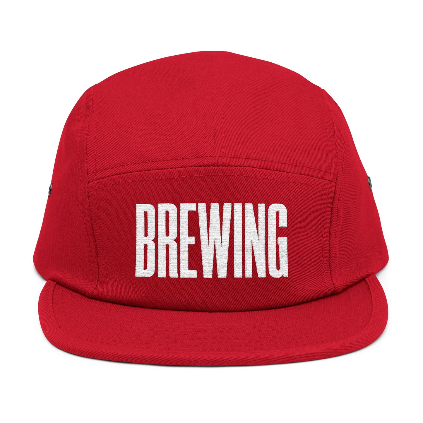 Red cap with 'BREWING' text on a white background. BREWING minimalist text embroidery design on 5-panel cap. TEEZOCA