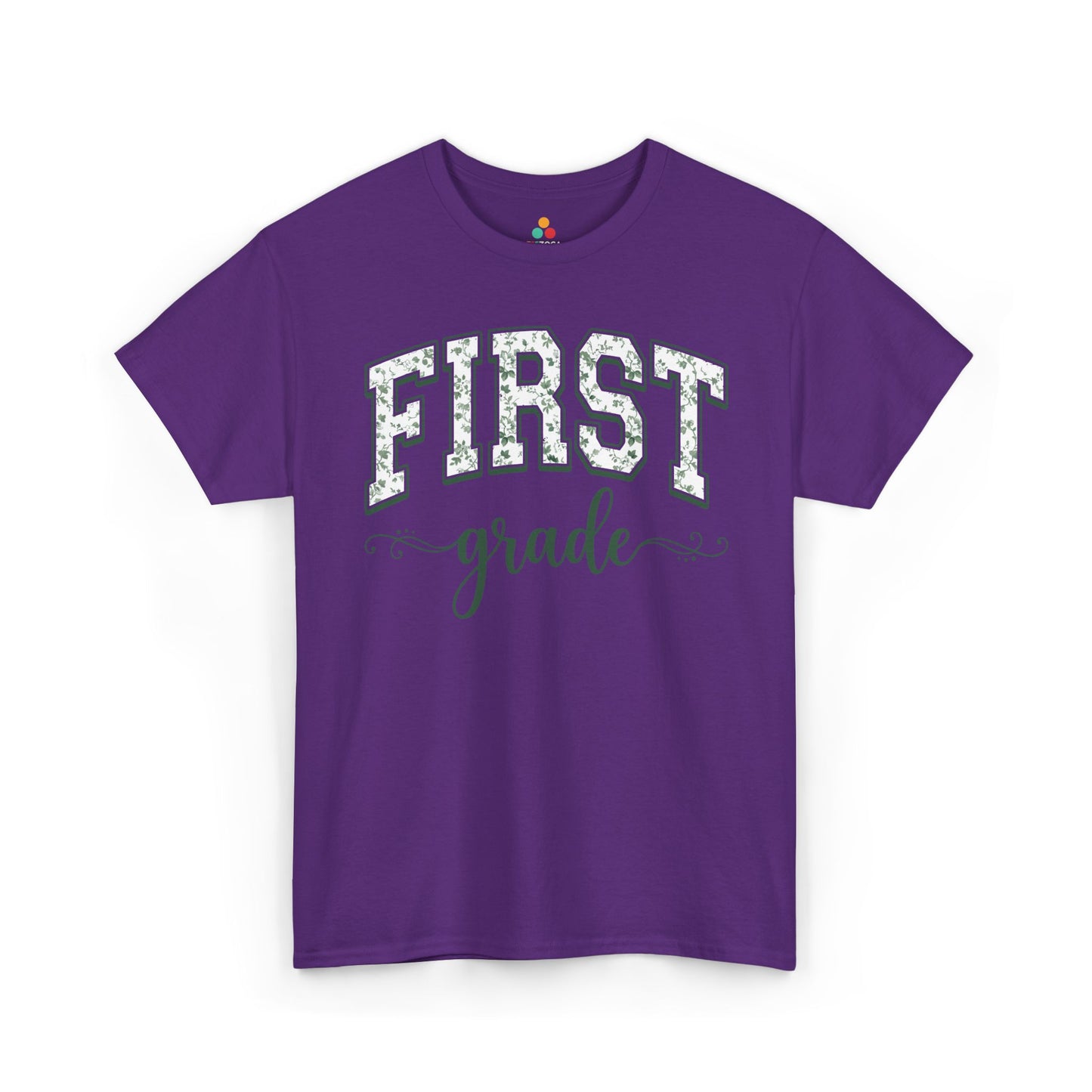 Purple t-shirt with 'FIRST grade' text on a white background. TEEZOCA floral back to school t-shirt for first grade teachers and staff, an adult tee found on Amazon and Etsy.

