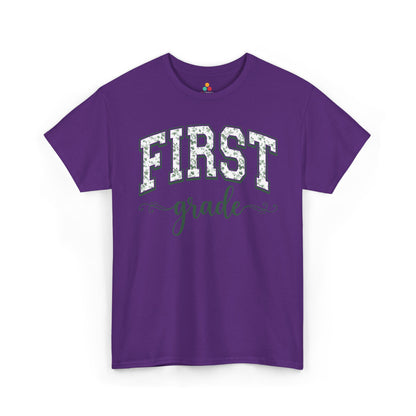 Purple t-shirt with 'FIRST grade' text on a white background. TEEZOCA floral back to school t-shirt for first grade teachers and staff, an adult tee found on Amazon and Etsy.

