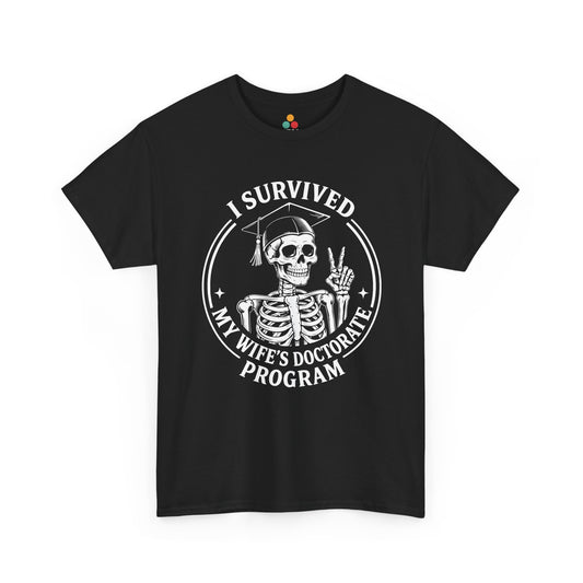 Black TEEZOCA t‑shirt with “I Survived My Wife’s Doctorate Program” skeleton graduation graphic shown flat.