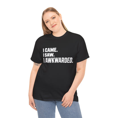 Person wearing a black t-shirt with humorous text 'I CAME. I SAW. I AWKWARDED' on a white background | TEEZOCA