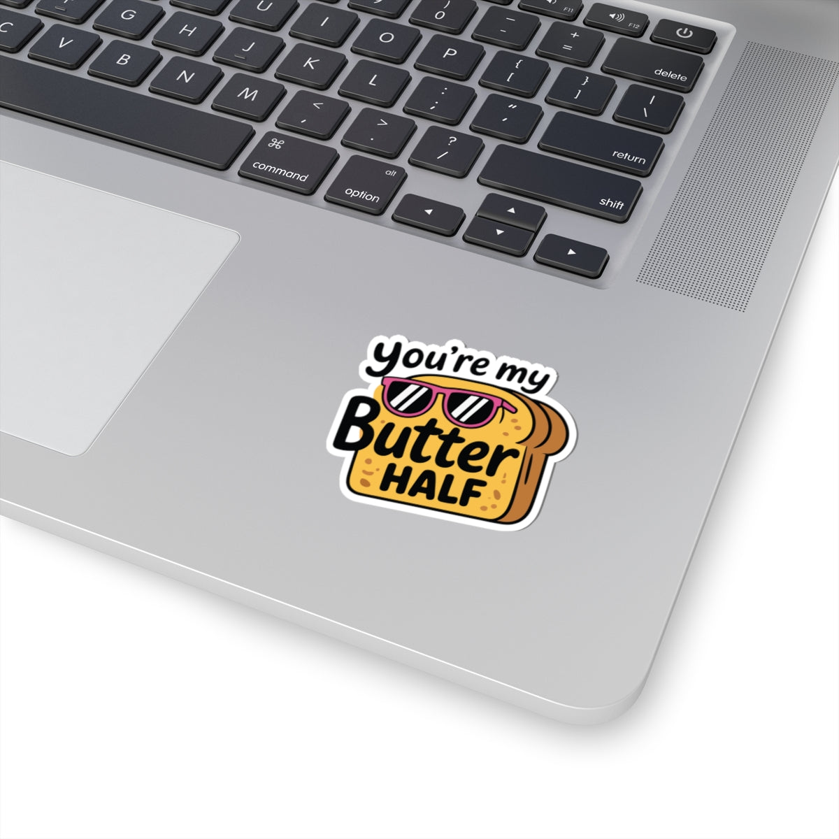 Laptop with a sticker reading 'You're my Butter HALF' on a white background. TEEZOCA