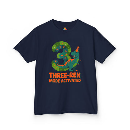 Purple kids' t‑shirt with colorful green T‑Rex wearing party hat, confetti, and "Three-Rex Mode Activated" text, flat front view.