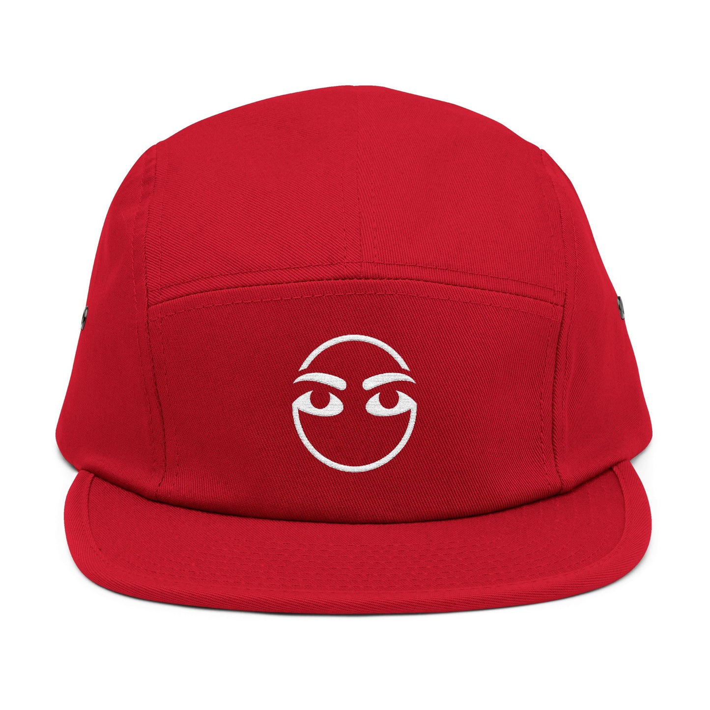 Red cap with a white face design on a white background. Expressive eyebrow and eye line-art graphic for embroidery. TEEZOCA