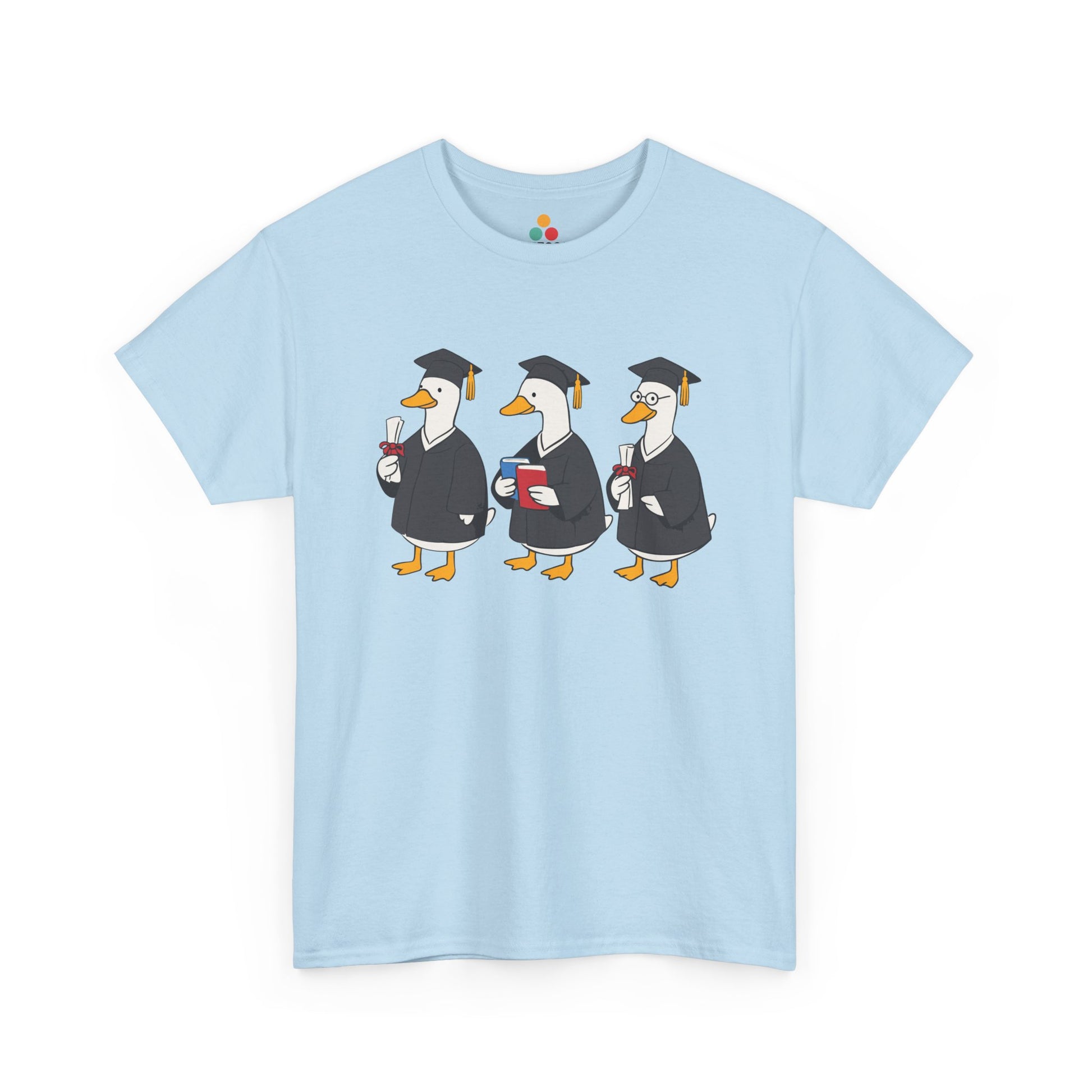 Light blue TEEZOCA t‑shirt with three graduation ducks printed on the front.