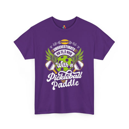 “Teezoca purple Never Underestimate an Old Man with a Pickleball Paddle shirt, bright green ball and white script graphic, novelty pickleball gift tee, front.”

