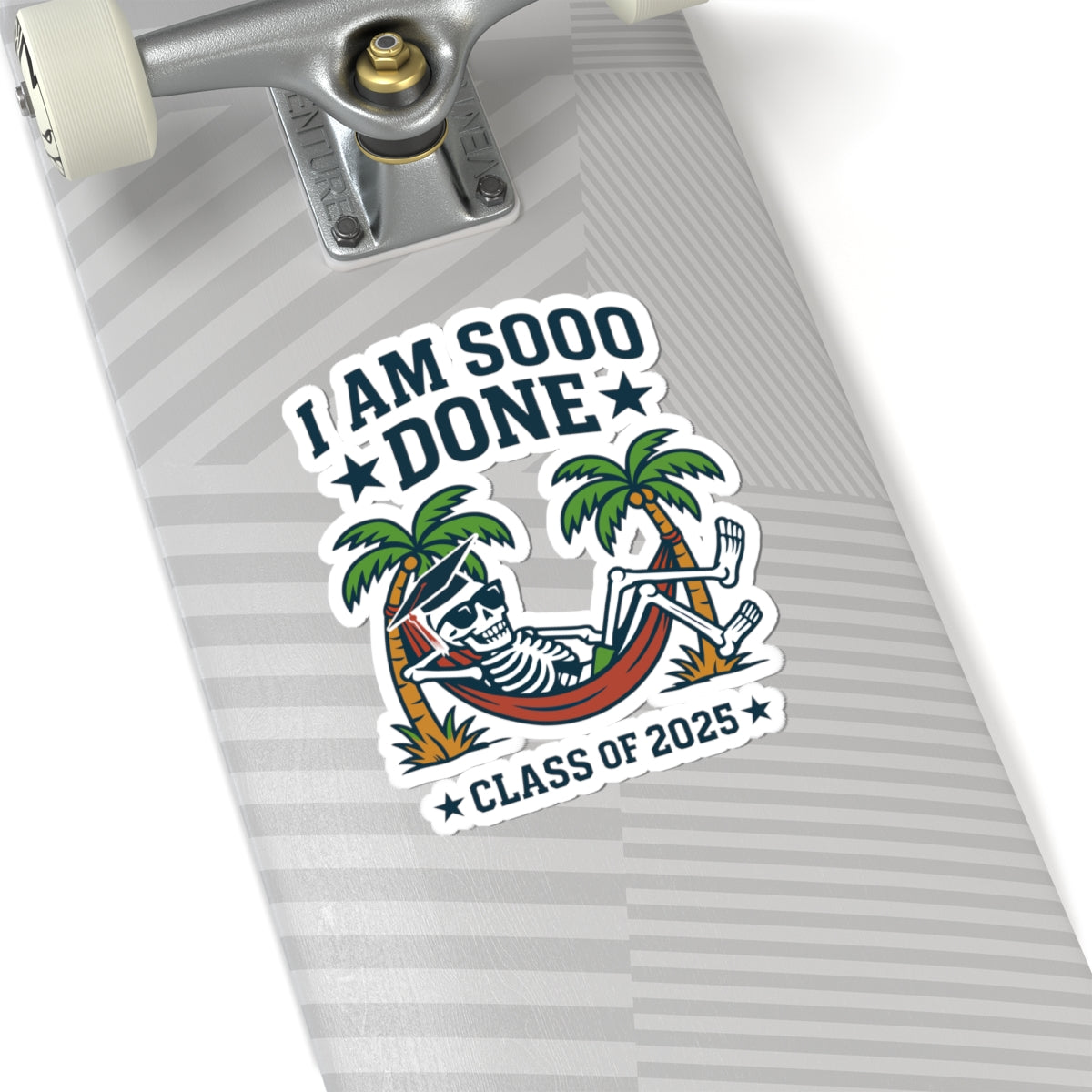 Skateboard with a 'I am sooo done' Class of 2025 sticker featuring a skeleton in a hammock.