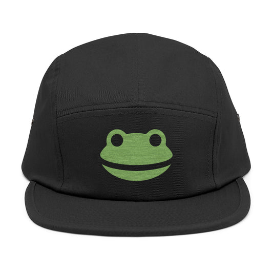 Black cap with a green frog logo on a white background. Minimalist frog face embroidery design with wide smile and round eyes. TEEZOCA