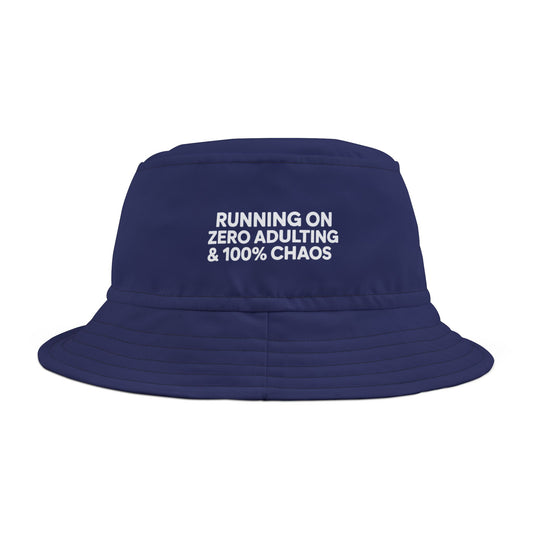 Funny sarcastic navy bucket hat with white text 'Running On Zero Adulting And 100% Chaos' on a white background. TEEZOCA
