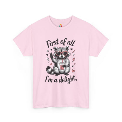 TEEZOCA pink “First of all I’m a delight” adorable raccoon graphic tee shown flat.