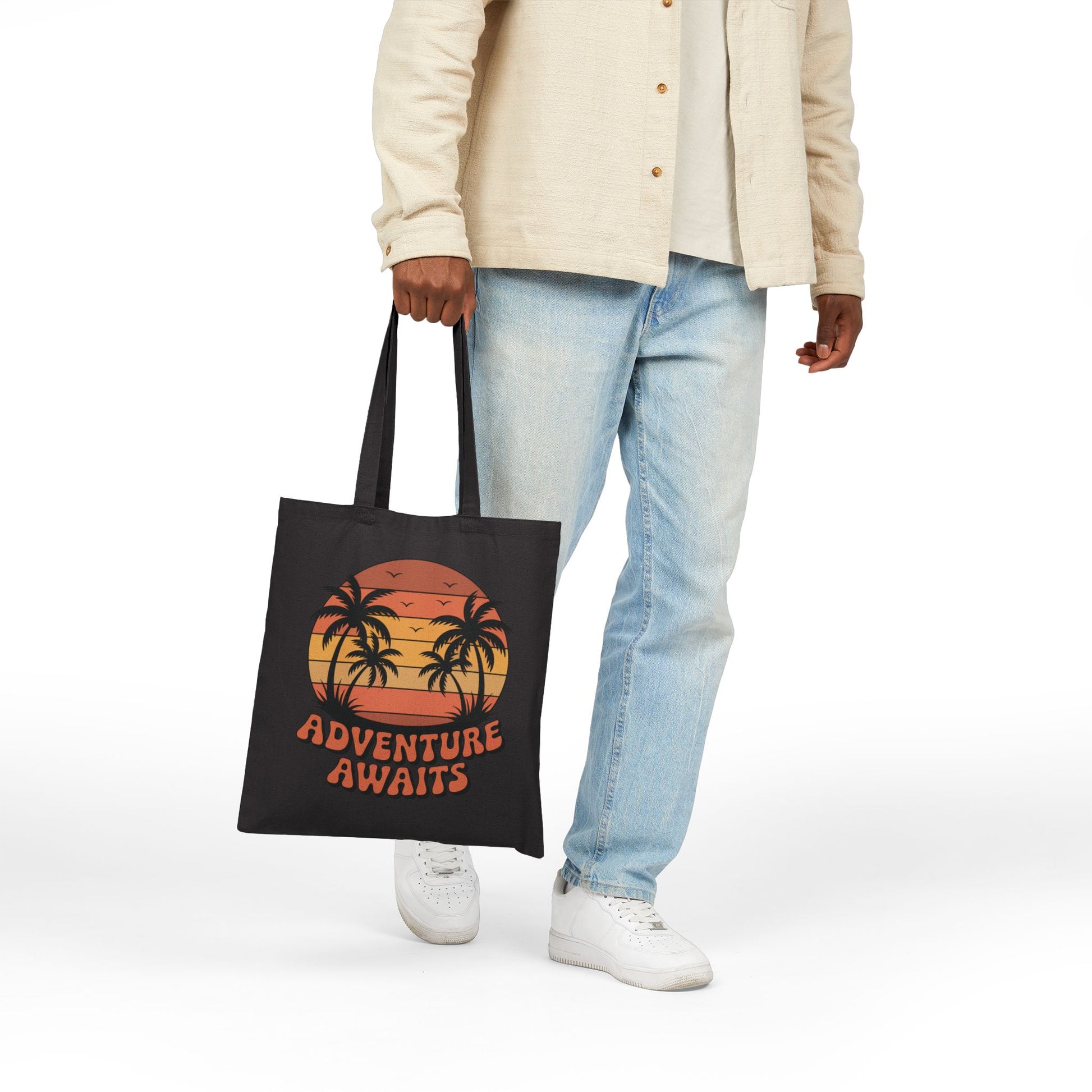 Adventure Awaits travel-inspired graphic displayed on a stylish TEEZOCA tote bag