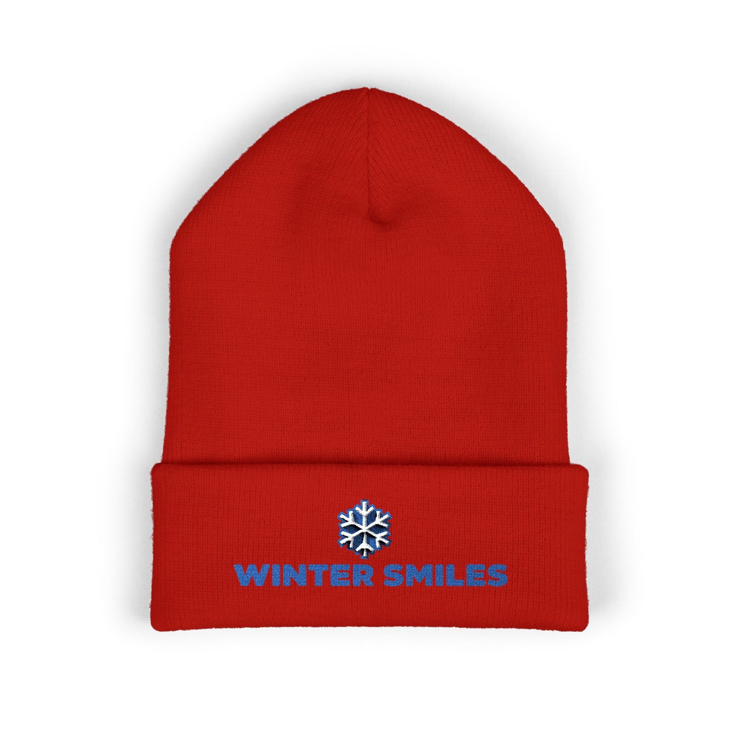 Red beanie with 'Winter Smiles' text and snowflake logo on a white background. Cuffed winter beanie featuring bold “Winter Smiles” lettering