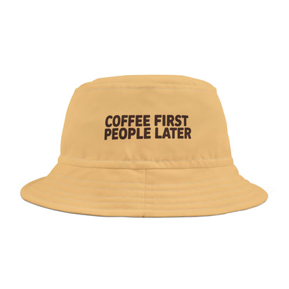 Funny yellow bucket hat with 'Coffee First, People Later' text on a white background. TEECOZA