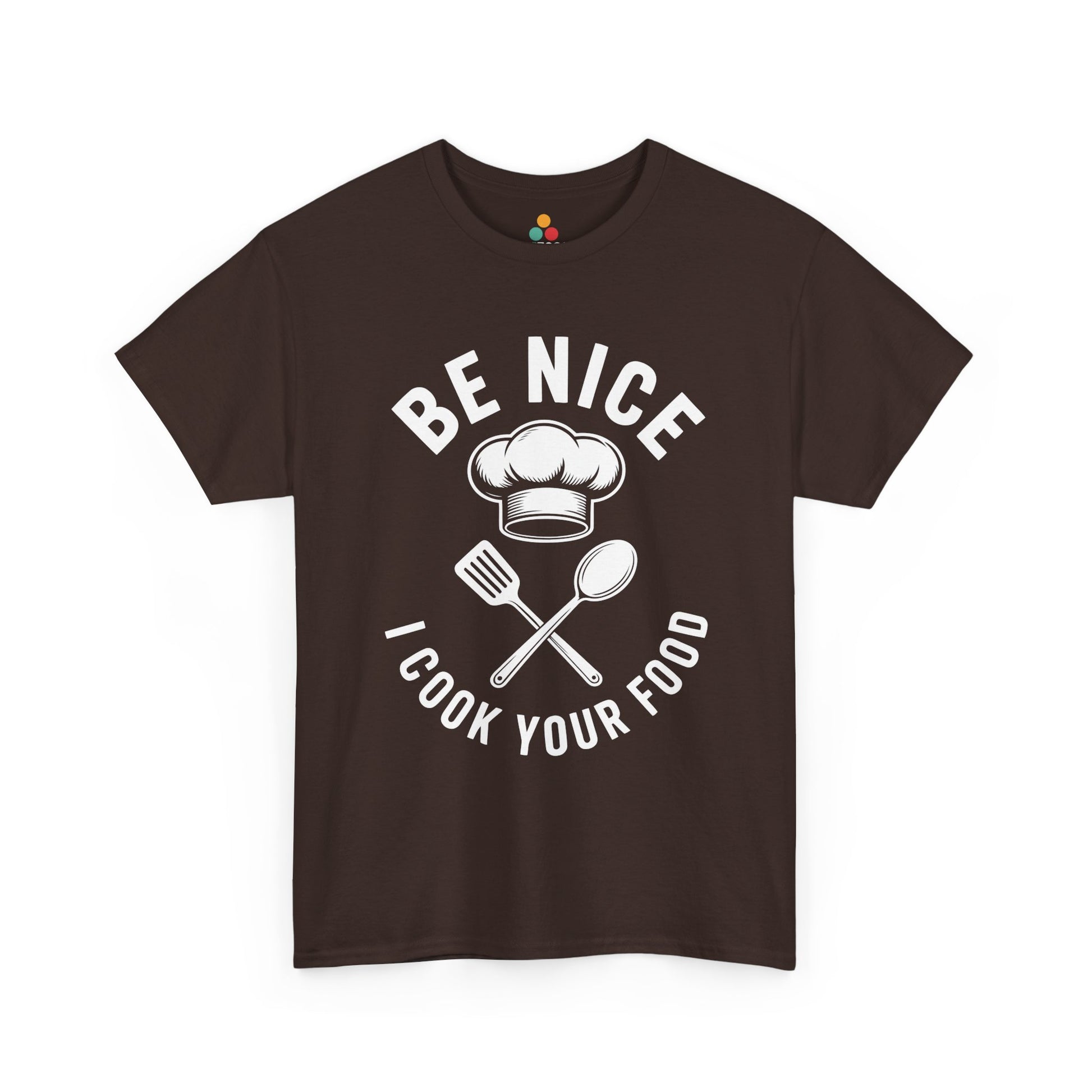 “Teezoca Be Nice I Cook Your Food t-shirt, bold kitchen quote and chef graphic, dark brown tee, front view.”

