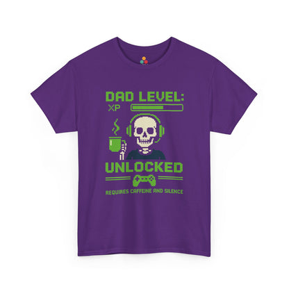 “Purple ‘Dad Level: XP Unlocked’ pixel gamer tee with skull, headset, coffee cup, and controller graphic, flat front.”

