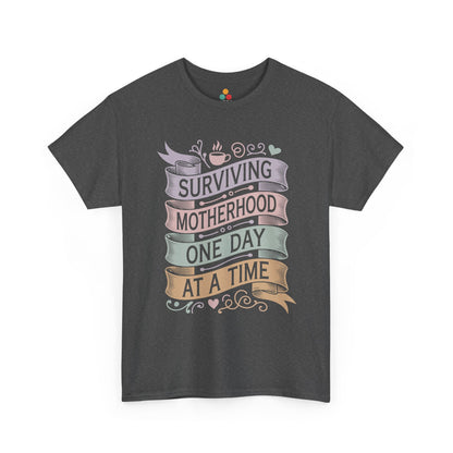 TEEZOCA dark gray "Surviving Motherhood One Day At A Time" mom humor t‑shirt shown flat.