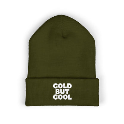 Green beanie with 'Cold But Cool' text on a white background