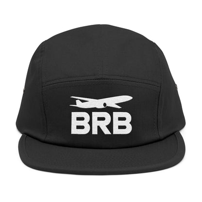 Black cap with 'BRB' and airplane design on a white background. Minimalist BRB airplane embroidered design for 5-panel cap by TEEZOCA