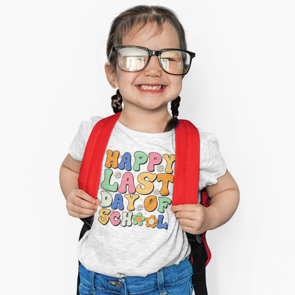 “Teezoca Happy Last Day of School kids shirt, bright groovy design on white tee, child model with backpack, front view.”

