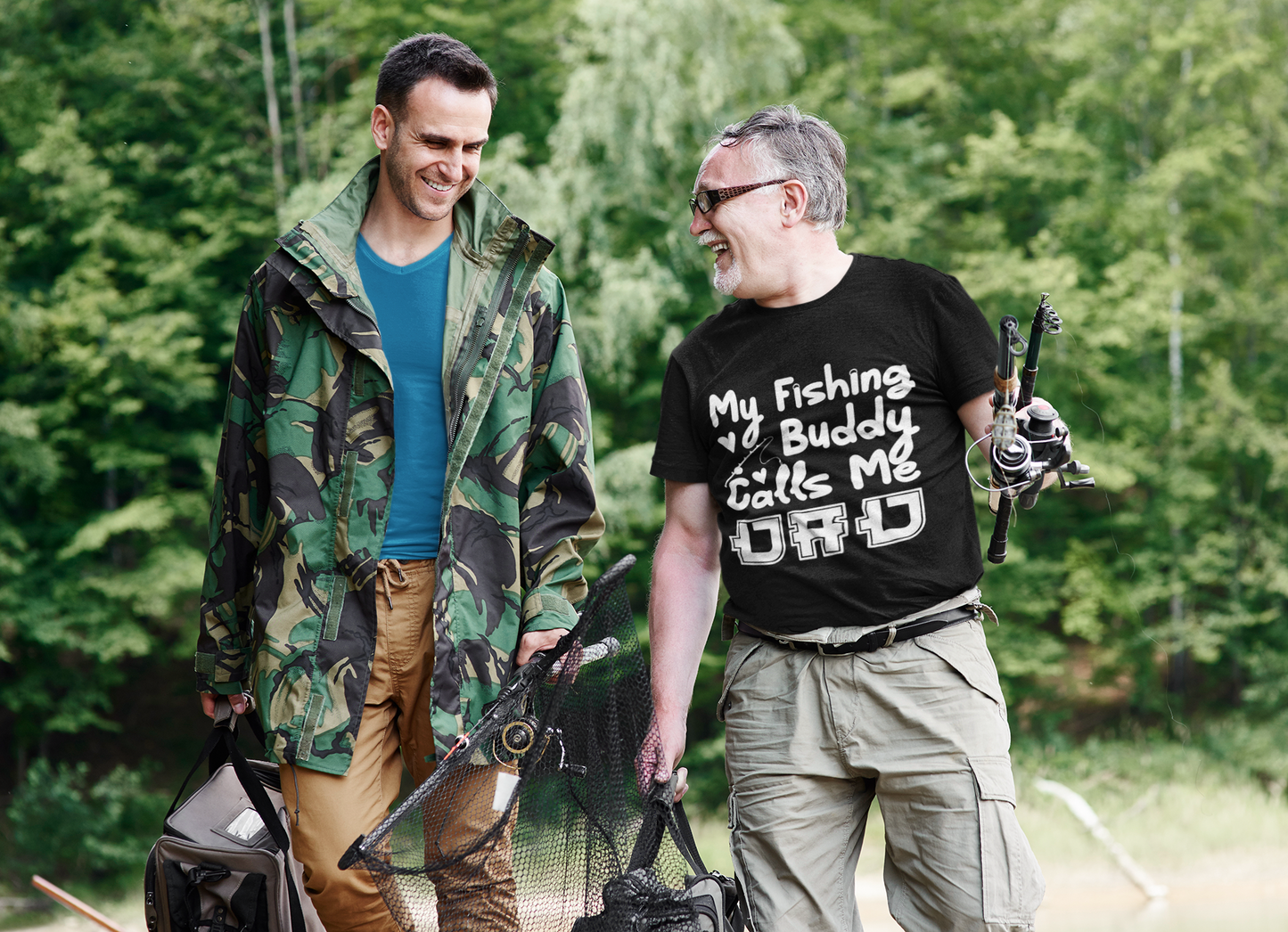 “Father and child wearing My Fishing Buddy Calls Me Dad graphic t‑shirts, outdoor lifestyle Father’s Day fishing theme photo – Teezoca product mockup.”