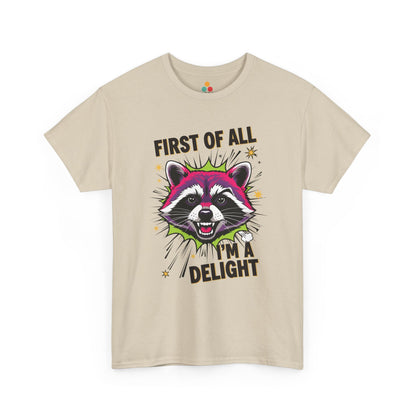 TEEZOCA beige “First Of All I’m A Delight” raccoon t‑shirt displayed flat.