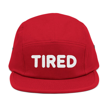 Red cap with 'TIRED' text on a white background. TIRED minimalist text embroidered on 5-panel cap by TEEZOCA