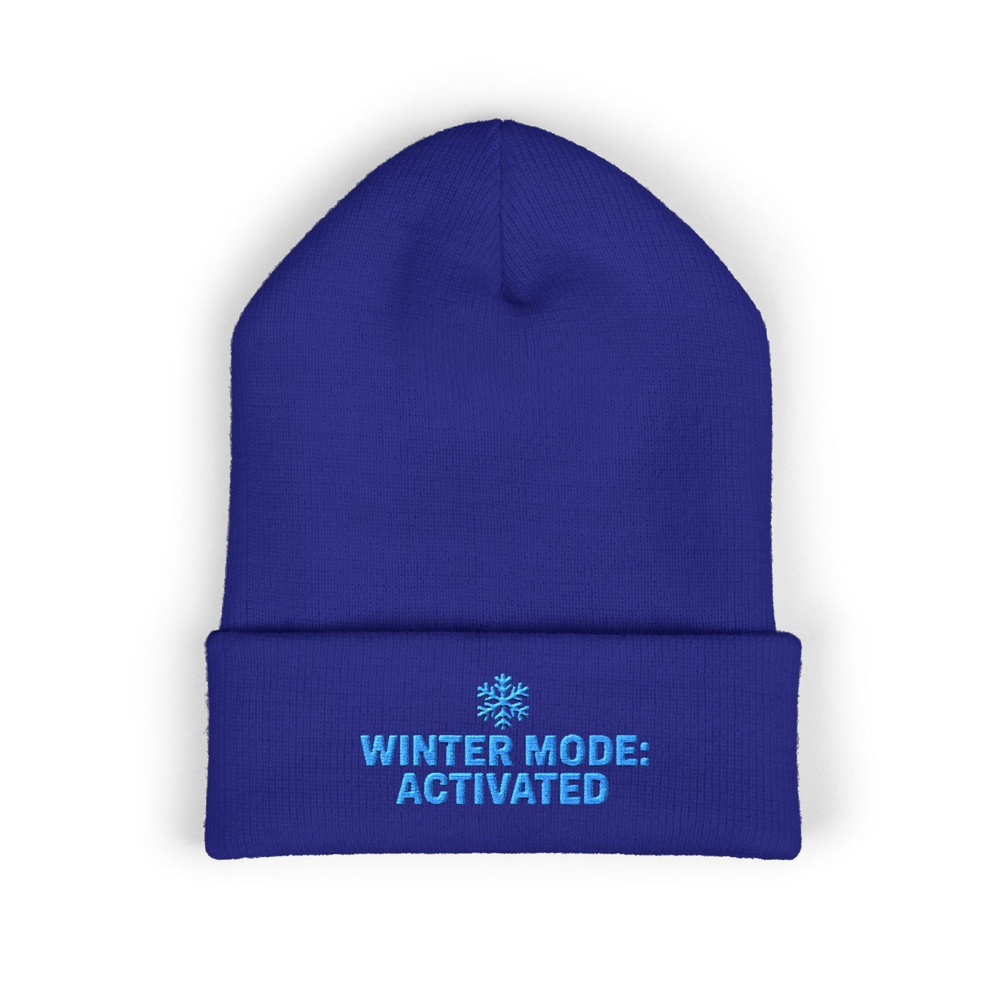 Blue beanie with 'Winter Mode: Activated' text on a white background. Blue snowflake winter beanie with ‘Winter Mode Activated’ text embroidery