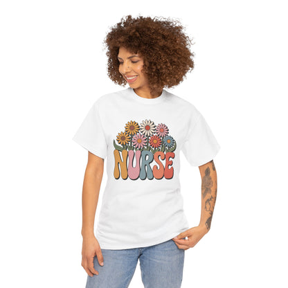 “Female model in Teezoca floral Nurse shirt, colorful daisy bouquet over retro NURSE letters, white tee, casual pose.”

