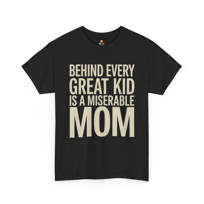 TEEZOCA black “Behind Every Great Kid Is A Miserable Mom” bold text t‑shirt shown flat.