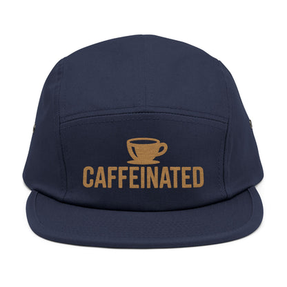 Navy blue cap with 'CAFFEINATED' text and coffee cup graphic on a white background. Caffeinated coffee cup icon embroidered design on five-panel cap. TEEZOCA