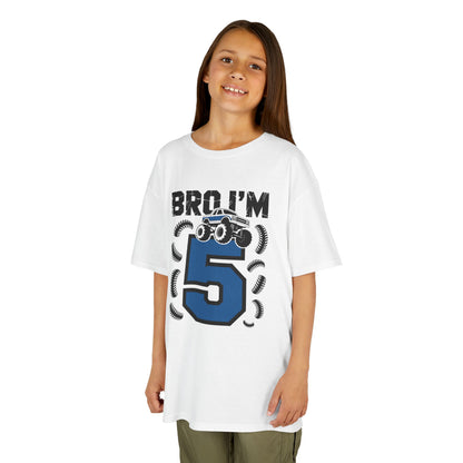 Child wearing a white t-shirt with 'Bro I'm 5' graphic design on a  White kids' t‑shirt with "Bro I'm 5" dirt bike motorcycle graphic in blue and black, flat front viewbackground