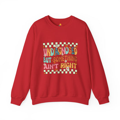 Red sweatshirt with colorful text and pattern on a white background