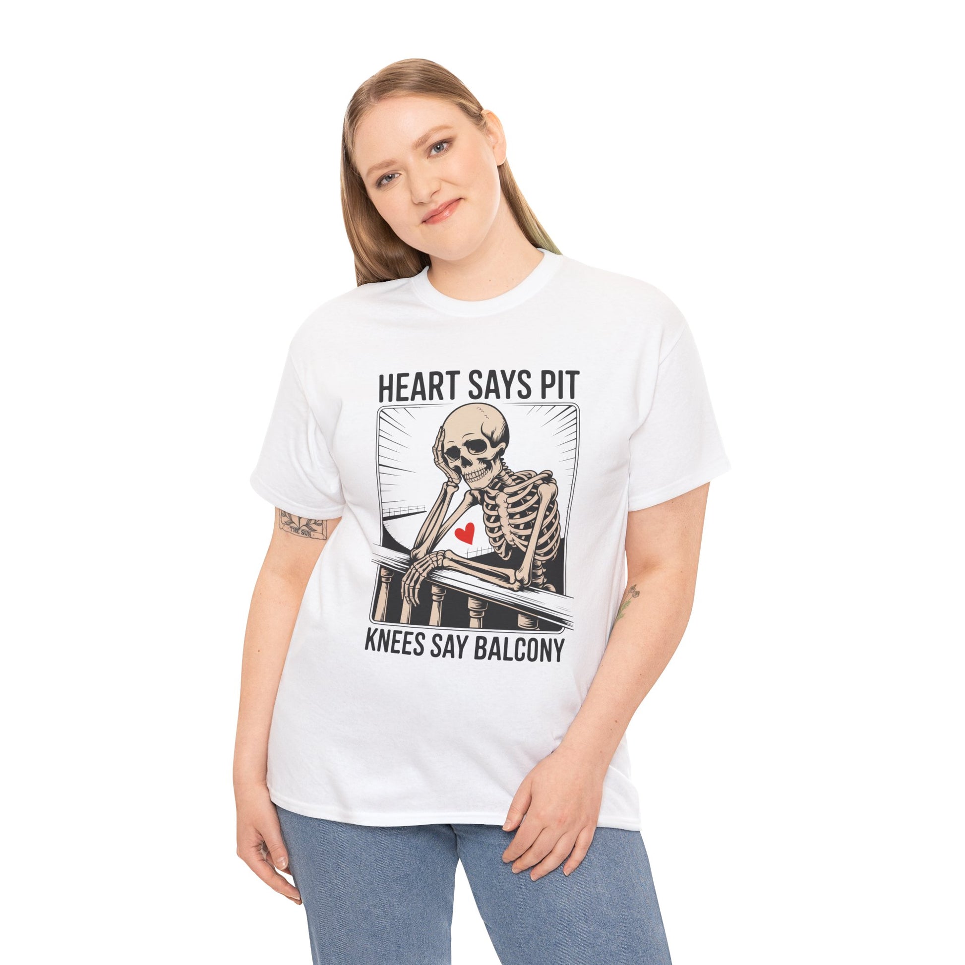 Female model wearing white “Heart Says Pit Knees Say Balcony” skeleton balcony concert quote t-shirt, front view.