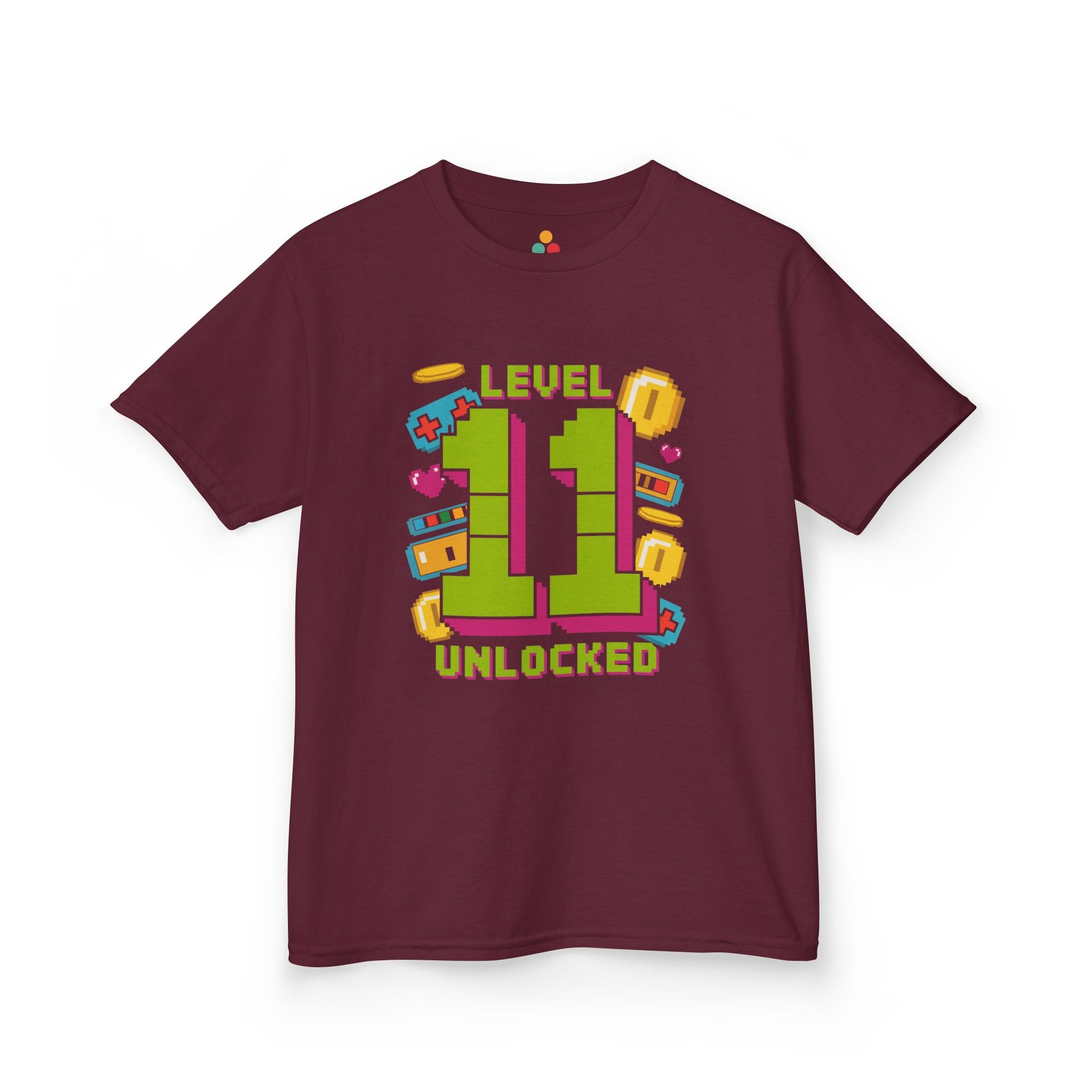 Dark green kids’ t‑shirt with neon green pixel “11” surrounded by gaming icons and “Level 11 Unlocked” text, flat front view.