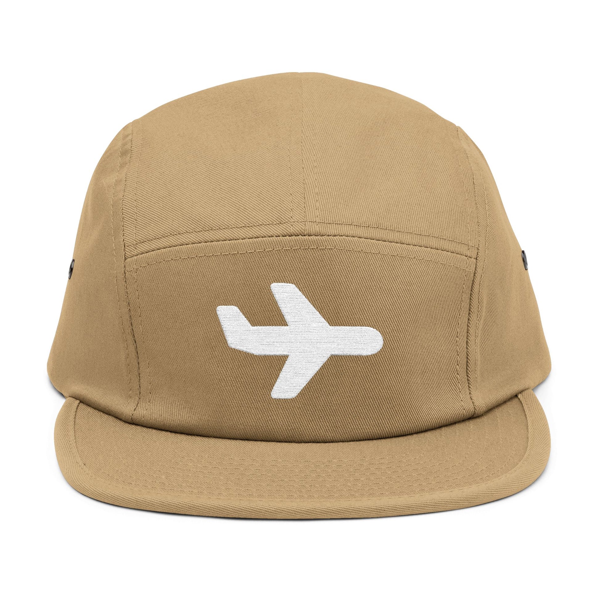 Tan cap with a white airplane emblem on a white background. Minimal white airplane icon embroidered on black 5-panel cap. TEEZOCA