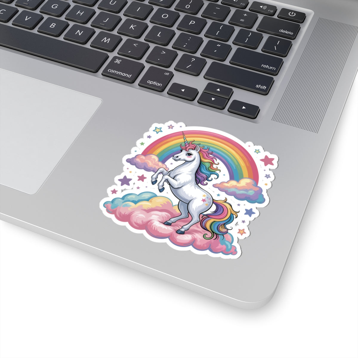 Laptop with a colorful unicorn sticker on the palm rest area. TEEZOCA