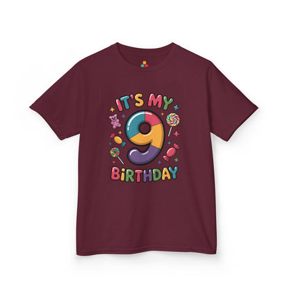 “Maroon kids ‘It’s My 9th Birthday’ shirt, rainbow 9 with sweets and stars, front view.”

