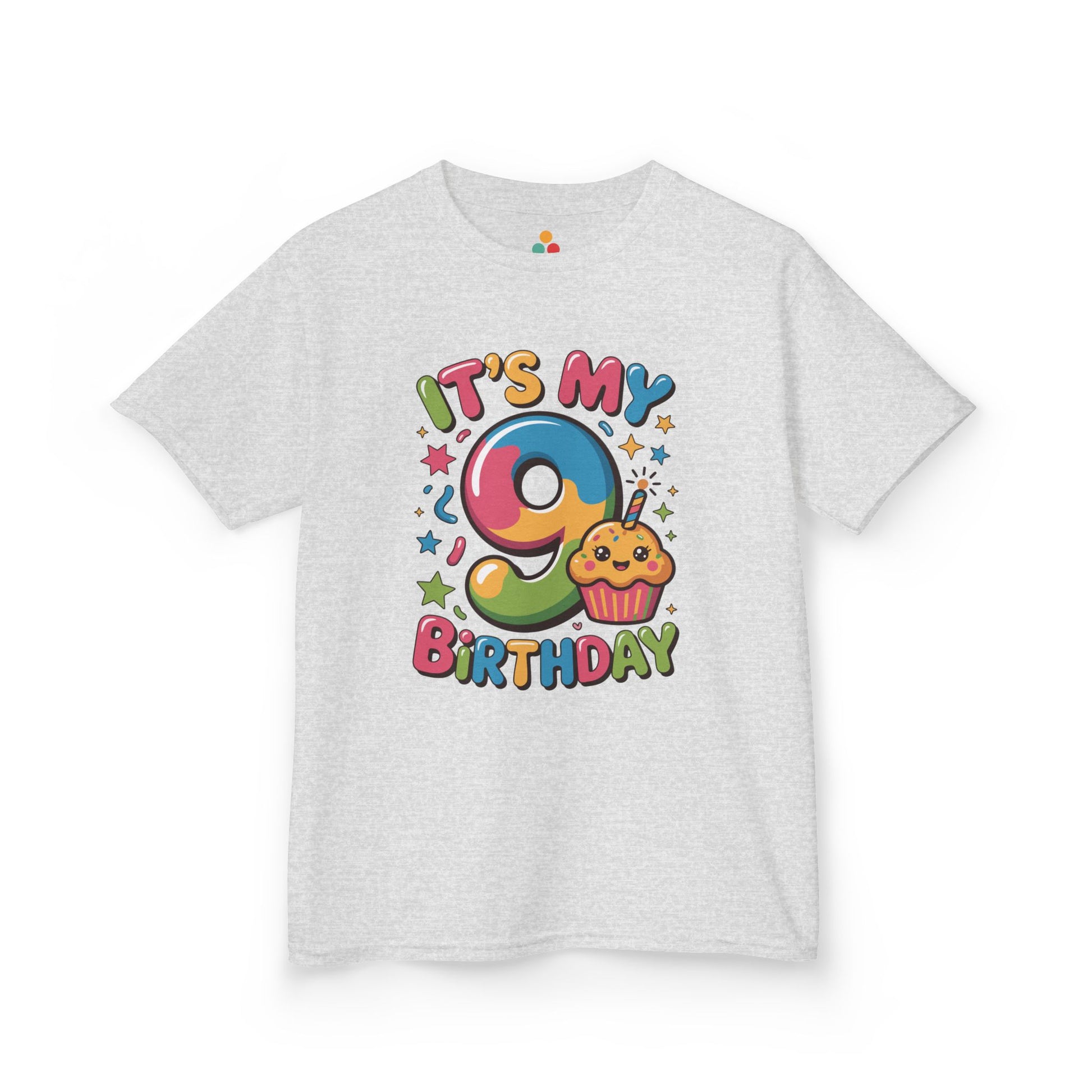 “White ‘It’s My 9th Birthday’ t-shirt with rainbow number 9, cute smiling cupcake and colorful stars, kids birthday design, flat front view.”

