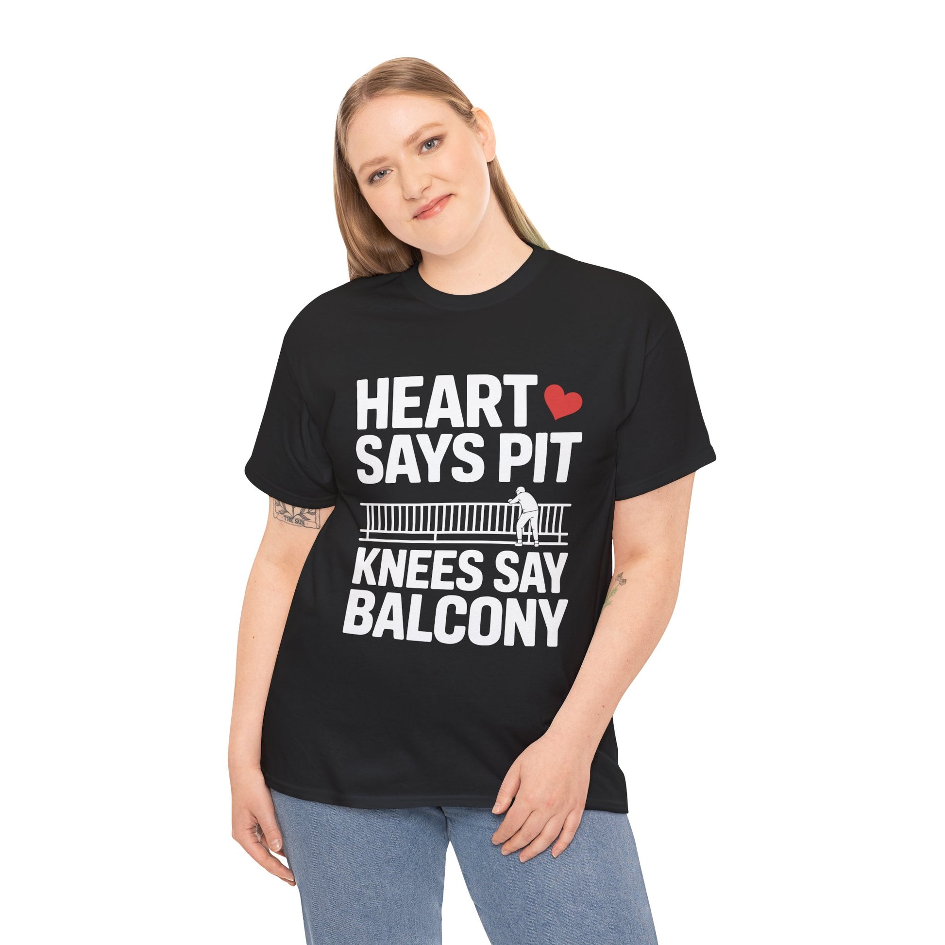 Female model wearing black “Heart Says Pit Knees Say Balcony” concert quote shirt, front view.