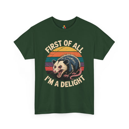 TEEZOCA forest green “First Of All I’m A Delight” opossum t‑shirt displayed flat.
