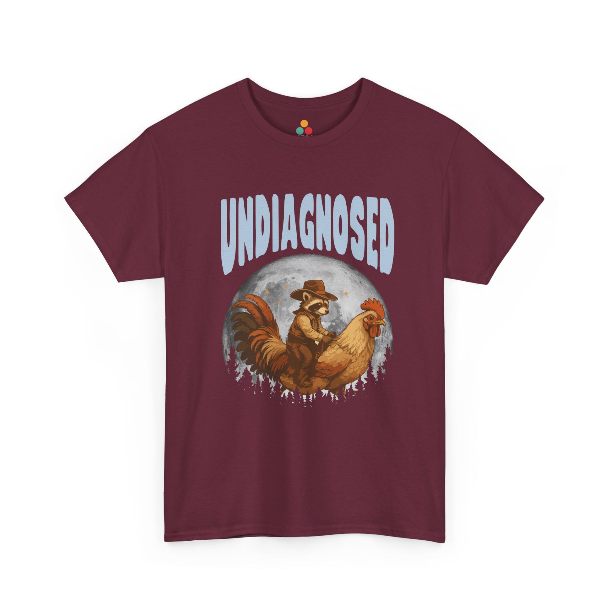 "Maroon unisex t‑shirt with white 'Undiagnosed' western text and vintage cowboy raccoon artwork, flat display."

