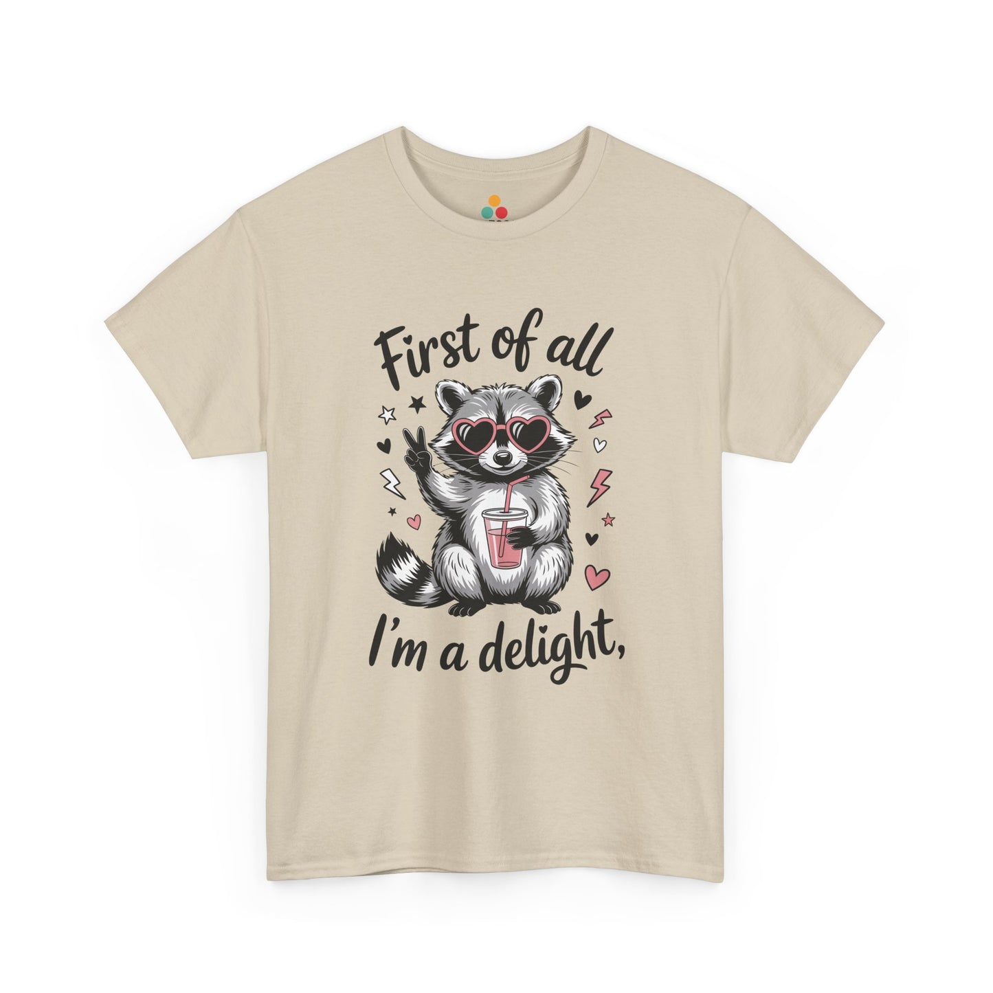 TEEZOCA beige “First of all I’m a delight” raccoon peace sign tee displayed flat.
