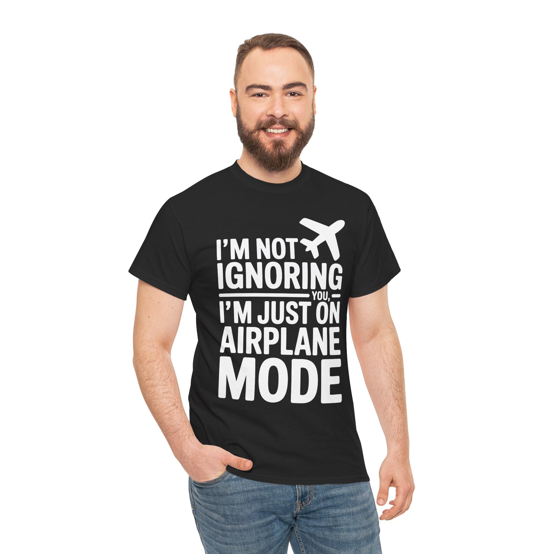 Man wearing a black t-shirt with " I'm Not Ignoring You, I'm Just On Airplane Mode " text and an airplane graphic on a white background | TEEZOCA