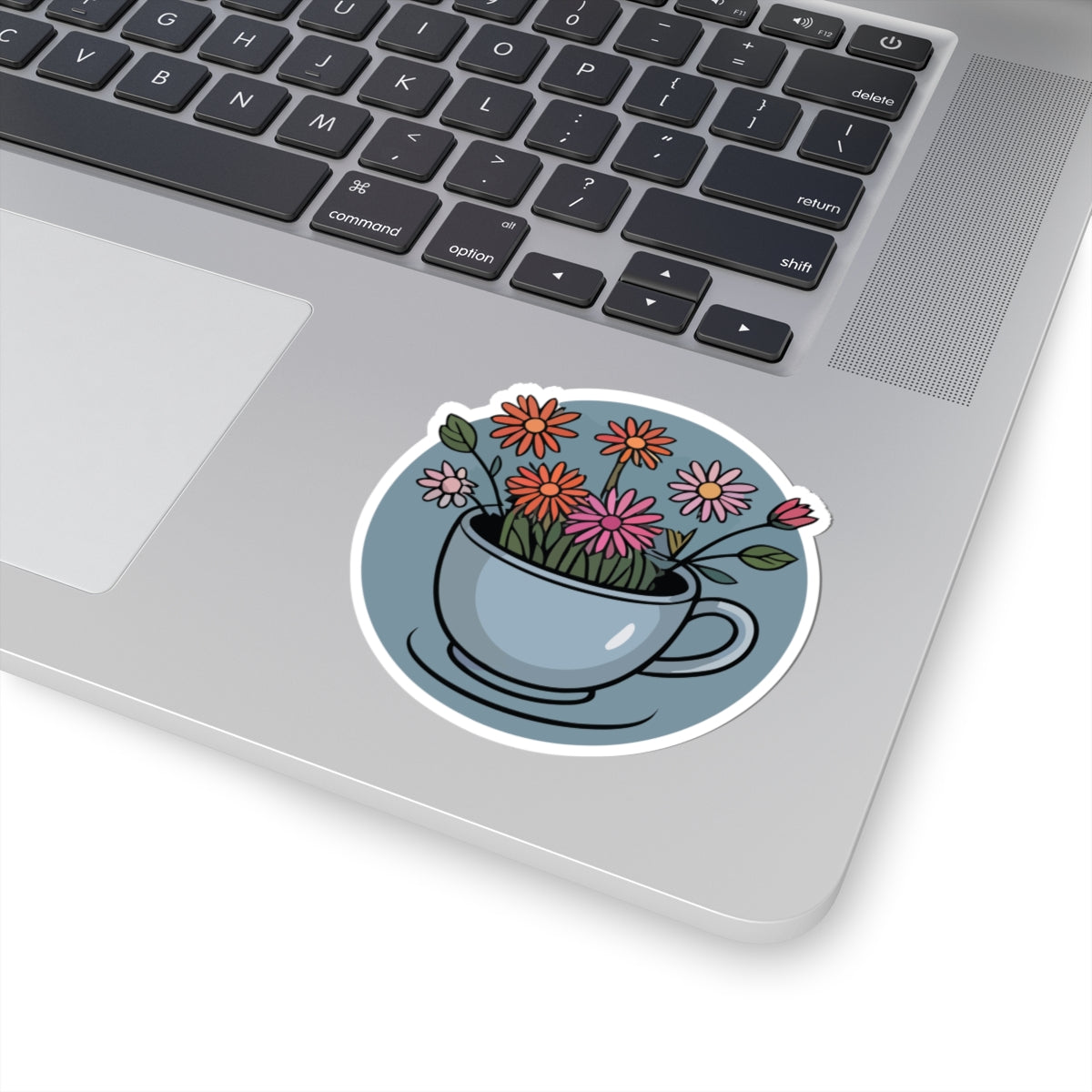 TEEZOCA flower teacup sticker featuring blooming wildflowers, cozy tea art, and soft pastel colors