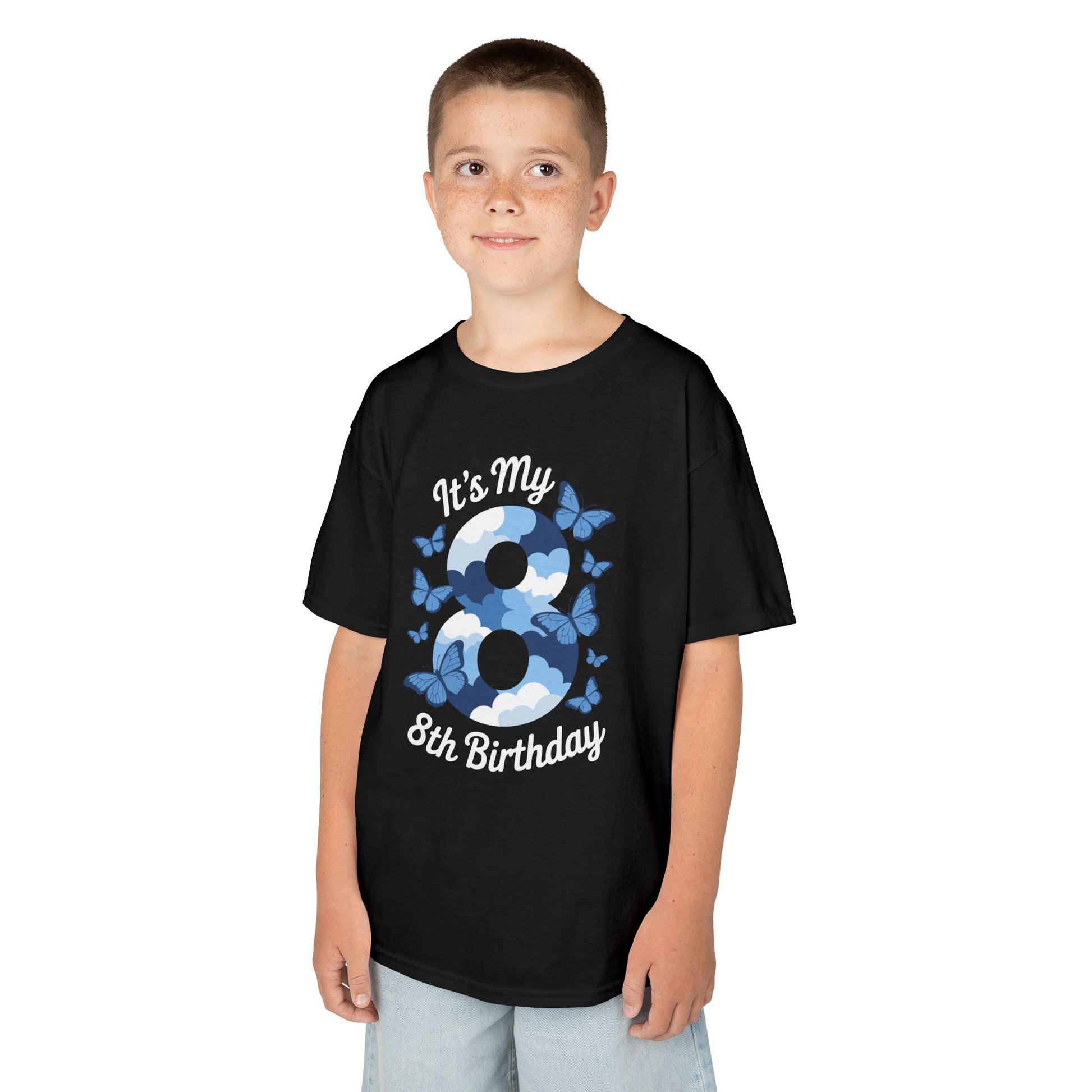 “Boy wearing black ‘It’s My 8th Birthday’ butterfly and clouds t-shirt, large number 8 graphic, front view.”

