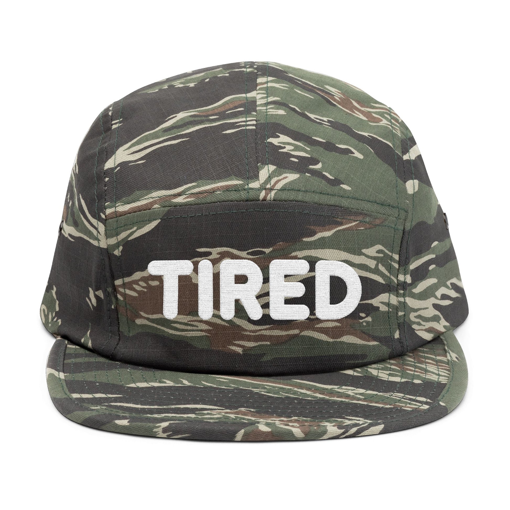 Camouflage cap with 'TIRED' text on a white background. TIRED minimalist text embroidered on 5-panel cap by TEEZOCA