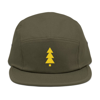 Green cap with a yellow tree logo on a white background. Minimalist geometric Christmas tree embroidery icon in gold.