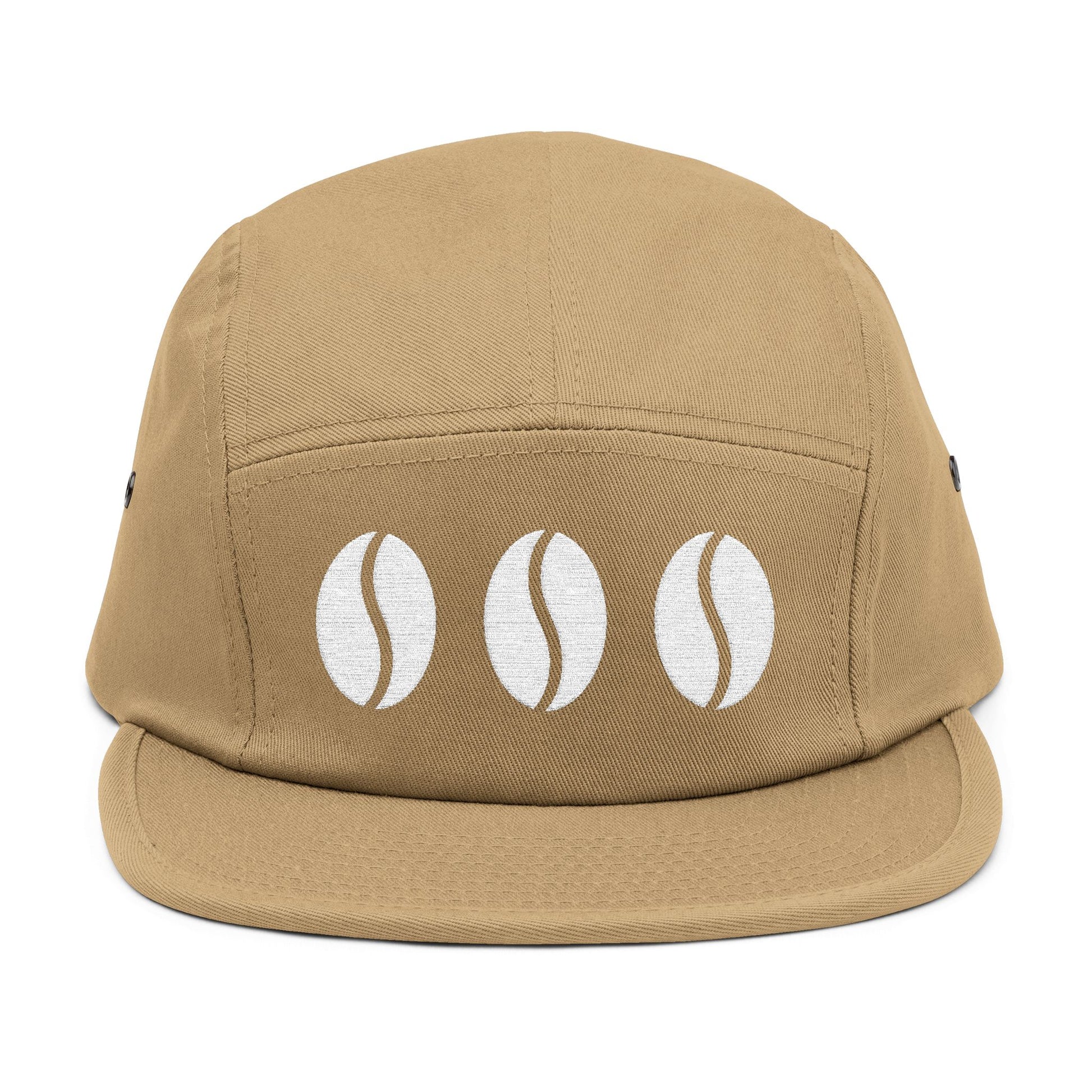 Beige cap with three white coffee bean icons on a white background. Triple coffee bean minimalist embroidery on 5-panel cap. TEEZOCA